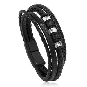 Detail view of multi-layer braided black leather bracelet with silver textured rings and magnetic clasp