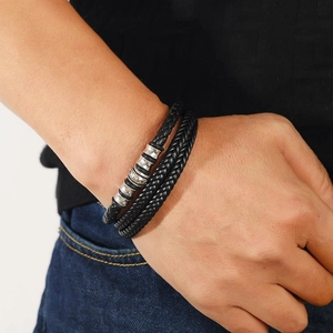Men's multilayered black braided leather bracelet with engraved silver metal charms