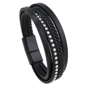 Detail view of multilayered black leather bracelet featuring silver rivets and magnetic buckle