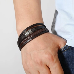 Men's fashion multilayer woven leather bracelet with vintage silver steel charms on wrist