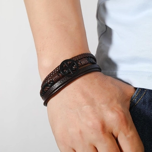 Men's multilayer leather braided bracelet with peace sign charm and magnetic clasp