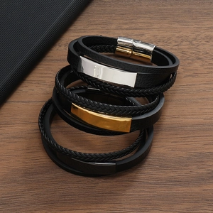 Detailed close-up of a 3-piece set of black braided leather bracelets with magnetic clasps