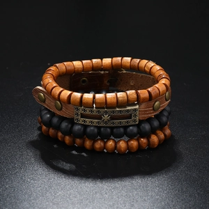 Detailed view of multilayer leather bracelet set with brown wood beads and metal plate