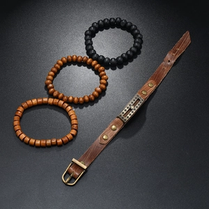 Set of four men's vintage leather and wooden bead bracelets with metal cross charms
