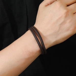 Men's vintage double-wrap braided leather bracelet with magnetic clasp on wrist