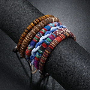 Bohemian handmade braided friendship bracelet set with ethnic wooden beads and colorful woven patterns
