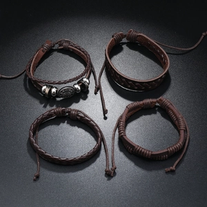 Set of four vintage brown leather braided bracelets with metal beads and adjustable cords