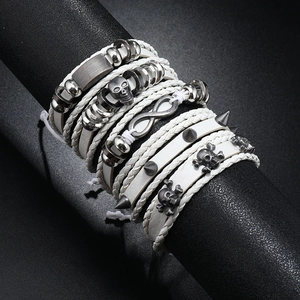 Detailed shot of punk men's multi-layer bracelets featuring skull and infinity symbols
