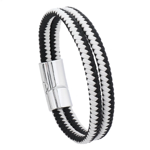 Detailed view of dual-layer black and white braided leather bracelet with silver magnetic clasp