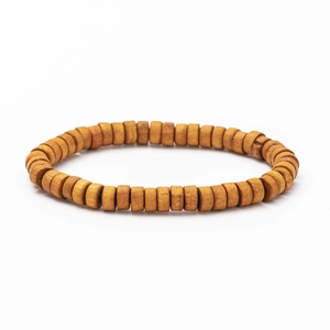 Detailed close-up of handmade Bohemian woven bracelet with natural wood beads