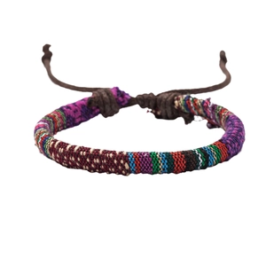 Bohemian handmade woven friendship bracelet with colorful ethnic patterns and adjustable cord