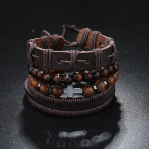 Close-up of multilayer leather bracelet with wooden beads and metal cross charm details