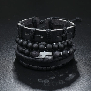 Detail view of multi-layer men's set with black leather, lava stone and cross pendant