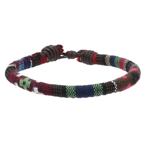 Detail of bohemian hand-woven multicolor fiber rope bracelets with ethnic knotted closure