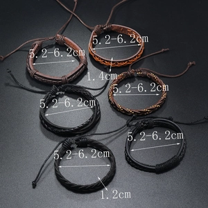 Detail showing dimensions of vintage leather bracelets with braided textures and metal beads