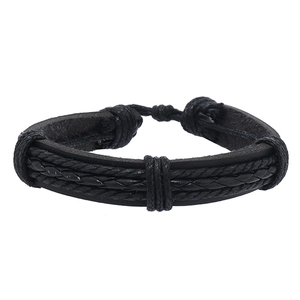 Detail of multi-layer black braided leather bracelet with adjustable drawstrings