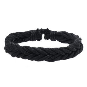 Detail view of the black braided rope texture and hand-woven knots of the bracelet