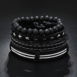 Detailed close-up of handmade multi-layer black bracelets with star charms and wood beads