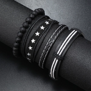 Men's handmade four-piece bracelet set with black beads and silver star charm