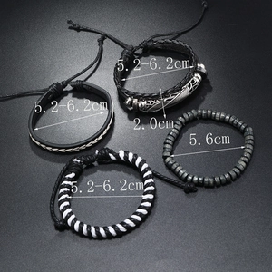 Detail of four-piece multilayer men's bracelet set with leather, wood beads, and metal feather