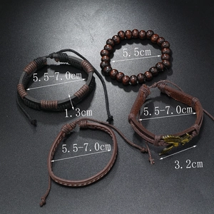 Detailed view of bronze eagle charm and hand-woven adjustable leather bracelets