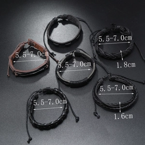 Detail view of 5-piece punk leather bracelets with braided cords and alloy leaf charm