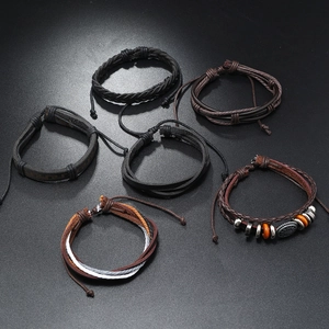 Set of six vintage braided leather bracelets for men with metal charms and wooden beads
