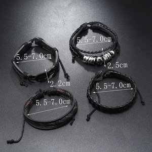 Detail view of 4-piece set black leather skull bracelets with size dimensions 5.5-7.0cm