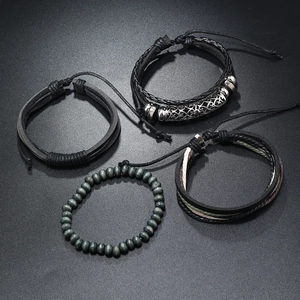 Detail of four-piece men's leather and wood bead bracelets with antique silver floral tube