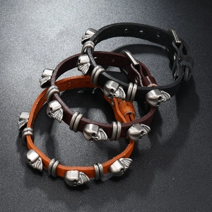 Punk skull leather bracelets set with metal rivets and adjustable buckle closures