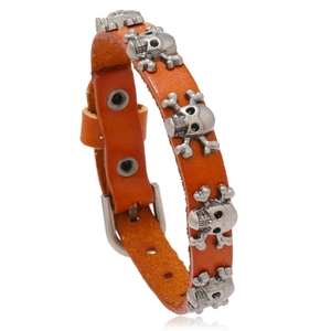 Orange punk leather bracelet with silver skull rivets and adjustable metal buckle closure