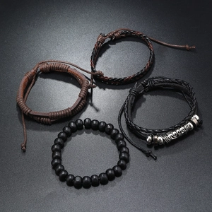 Close-up of a 4-piece vintage leather bracelet set with wood beads and alloy tube detail