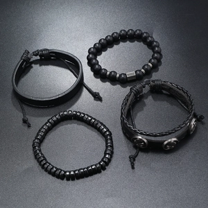 Close-up of a 4-piece men's black punk bracelet set with beads and braided leather