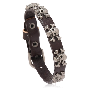 Punk brown leather bracelet with silver skull rivets and adjustable belt buckle closure
