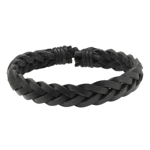Detailed close-up of a minimalist black braided leather bracelet with multi-strand texture