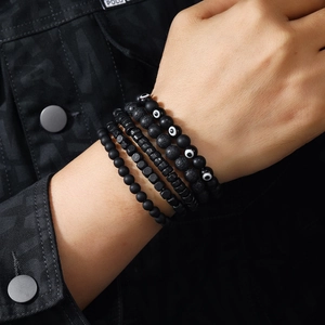 Men's 5-piece black evil eye beaded bracelet set featuring natural lava and matte stones
