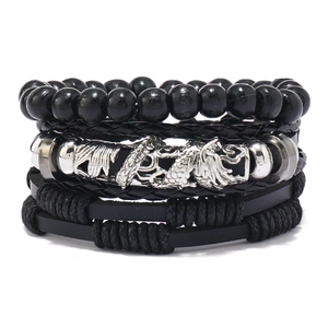 Detail of four-piece men's multilayer set with black beads and woven leather bracelets