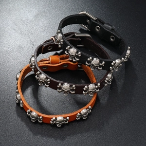 Three-piece punk leather bracelets with metal skull studs and adjustable belt buckles