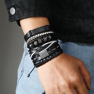 Detail of multi-layer men's braided leather bracelet with vintage metal beads