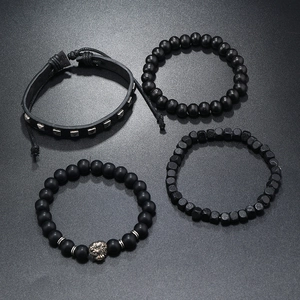 Detail of 4-piece men's set with leather strap, wooden beads, and silver lion head charm