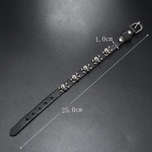 Black punk leather bracelet with silver skull studs and 25cm length measurement
