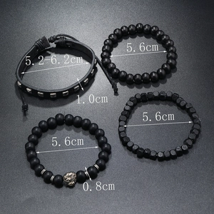 Detailed view of 4-piece black men's beaded bracelet set with golden lion head and leather