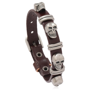 Punk brown leather bracelet featuring vintage silver skull studs and adjustable belt buckle