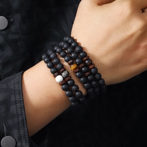 Three-layer set of volcanic stone and wood bead bracelets with tiger eye stone accents