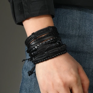 Five-piece black braided leather bracelet set for men featuring beads and feather charm
