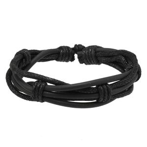 Close-up of black multilayer braided bracelet set with rubber tubes and cord textures
