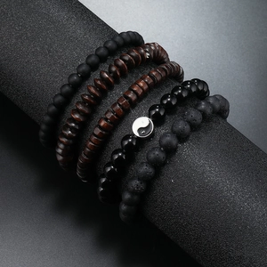 Set of four handmade natural stone and wood bead bracelets with Tai Chi Yin Yang charm