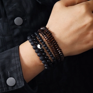 Men's 4-piece bead bracelet set featuring dark wood, black lava stone, and Yin Yang charm
