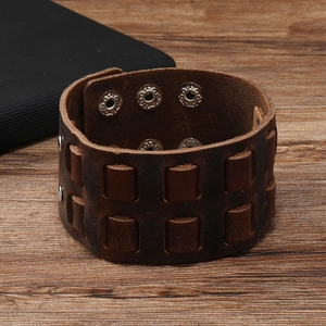 Vintage brown leather cuff bracelet with woven texture and adjustable silver snap buttons