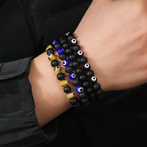Men's multi-layered evil eye bead bracelet set with black matte volcanic stone beads